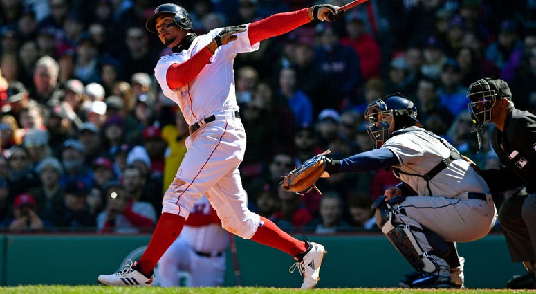 Xander Bogaerts follows through on his grand slam. Xander Bogaerts
